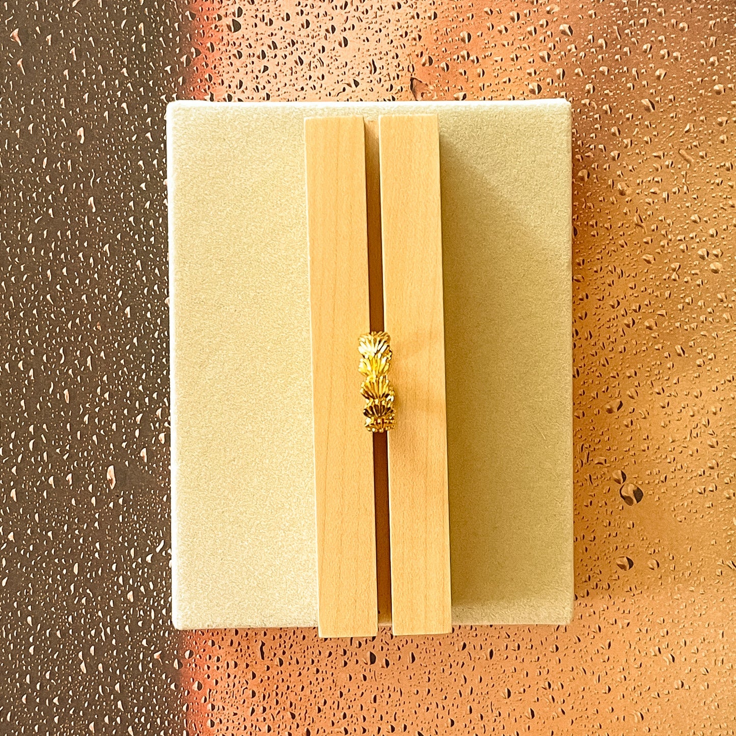 ring in a wooden base