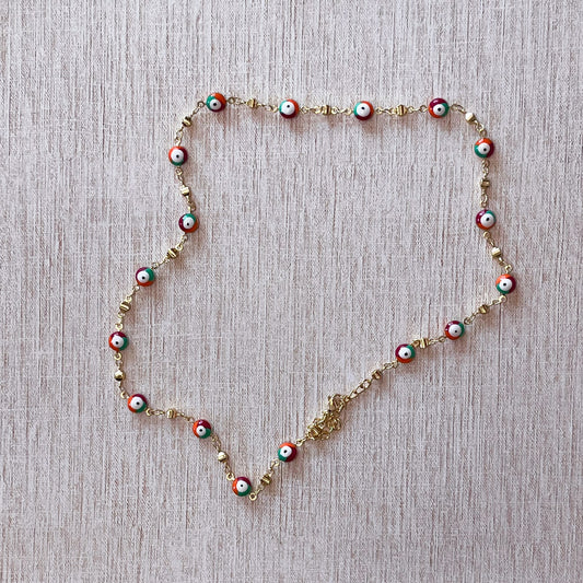 Necklace shaped like a heart on a gray background